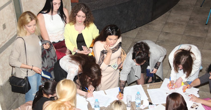 A photo of women signing up for a matchmaking event.